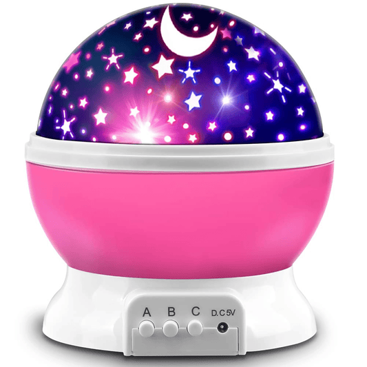 pink rotating star and moon projector night light casting stars on a kid's bedroom wall – view 2